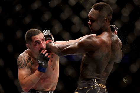 UFC 271 results: Israel Adesanya defeats Robert Whittaker in .